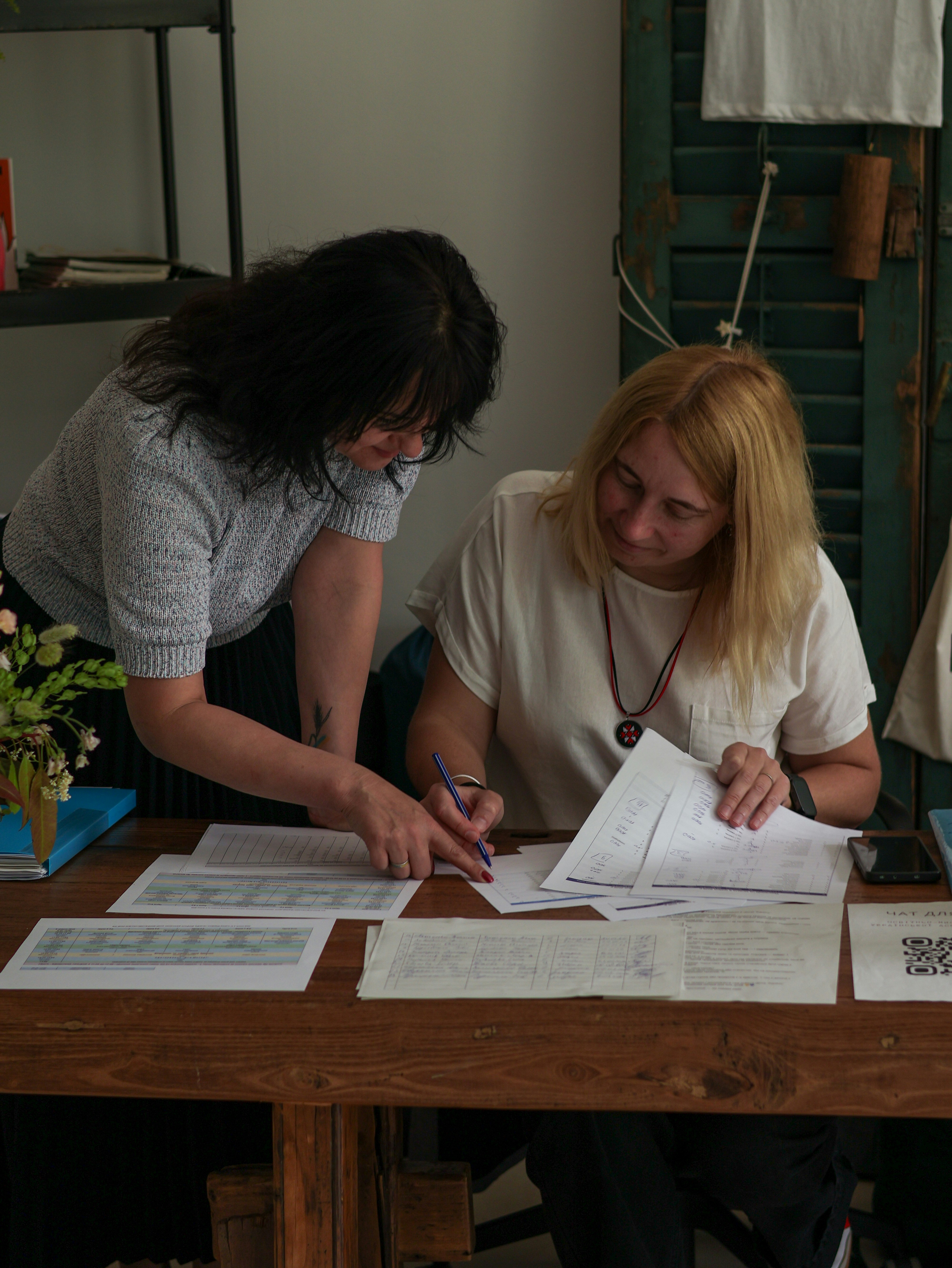 A spread from the 100+ page underwriting requirements — the dense tables agents had to cross-reference by hand.